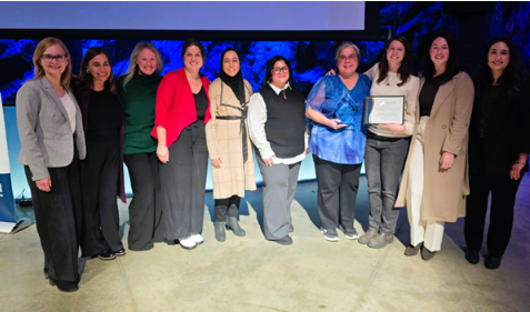 NEO Kids' Children's Treatment Centre School-Based Rehabilitation Speech-Language Pathology team pose for a photo with their Innovation award at the HSN Excellence in Action Awards in 2025.